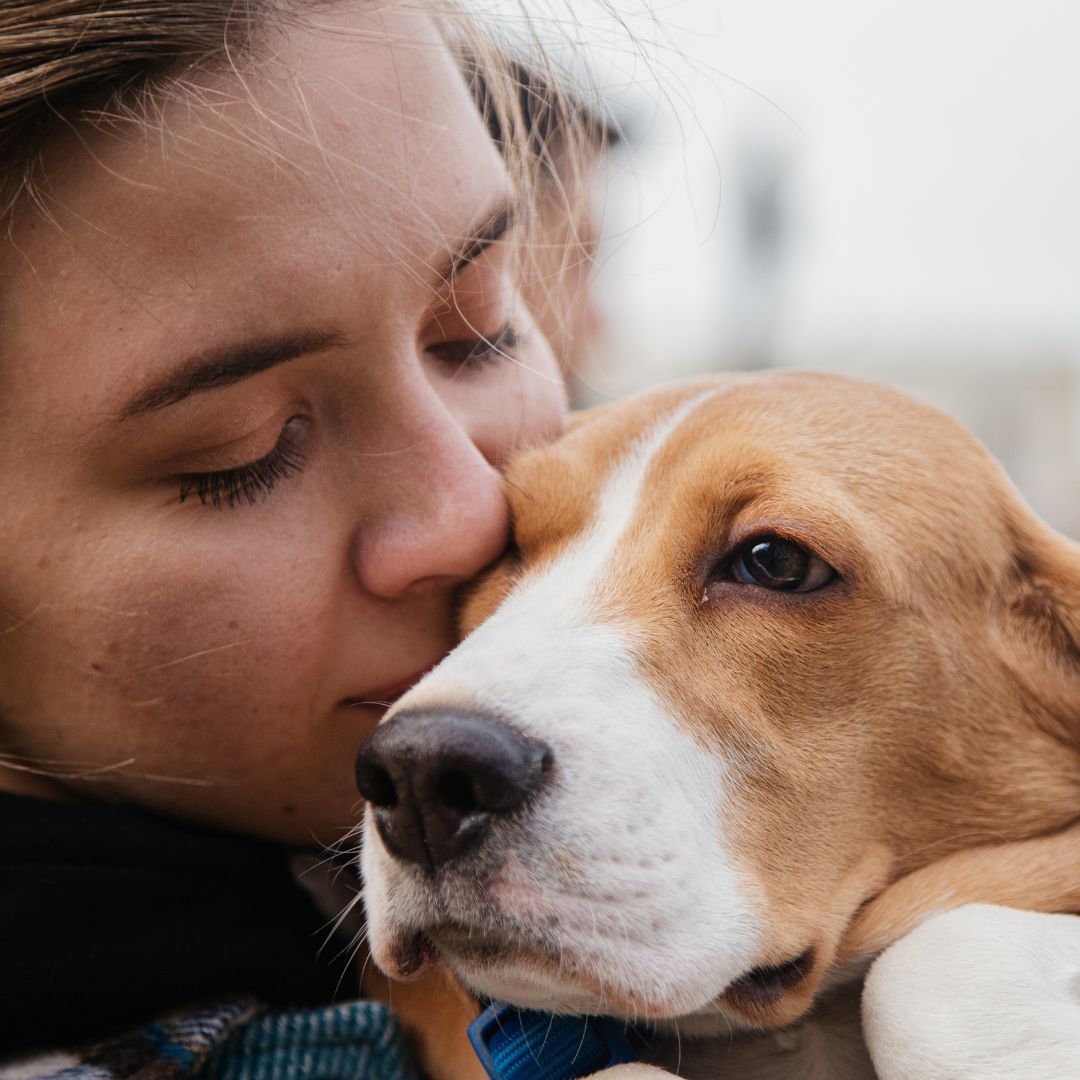 Close up of woman with beagle.