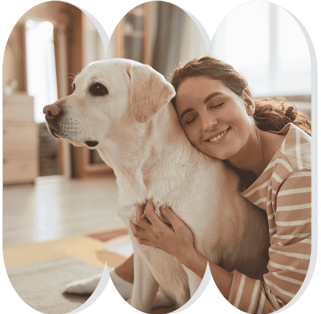 Woman cuddling a dog